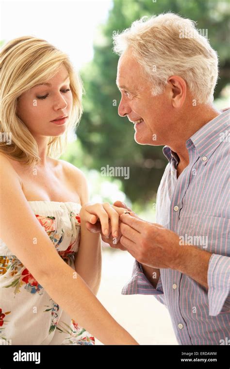 kissing old man|Old Man Young Woman Love stock videos and footage.